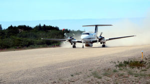 airplane on gravel strip in Igiugig, Alaska